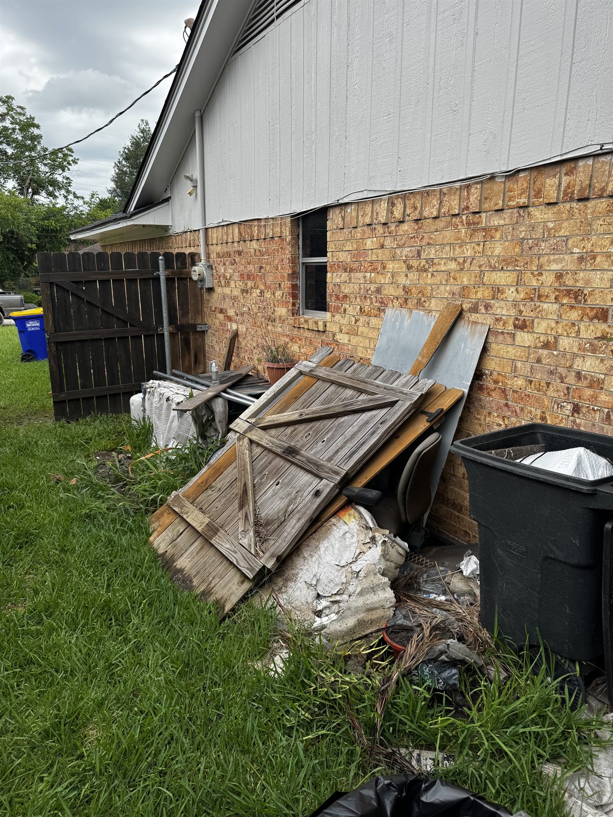 Property before cleanout — piles of junk and debris
