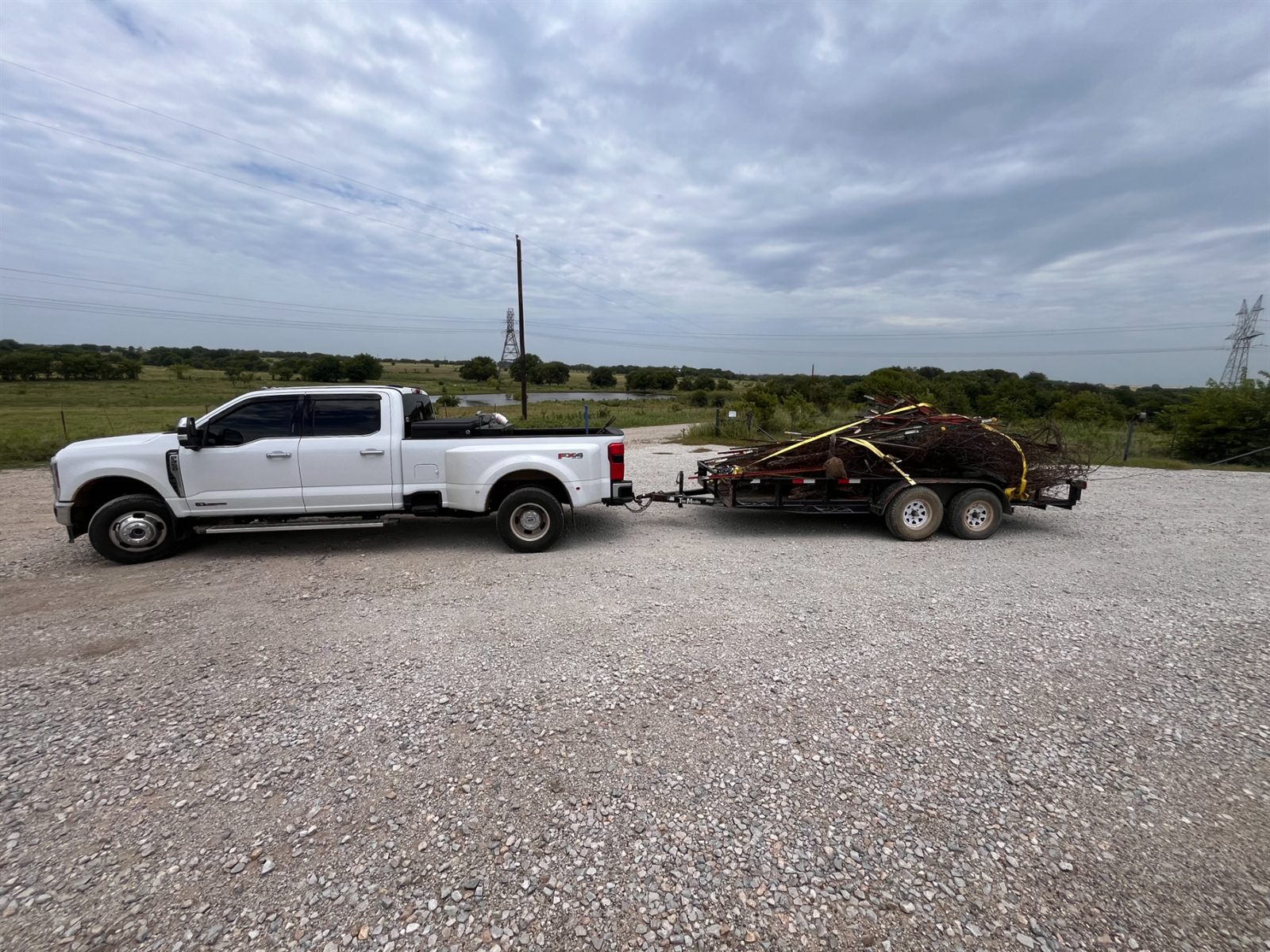 WR truck and trailer loaded with metal and brush